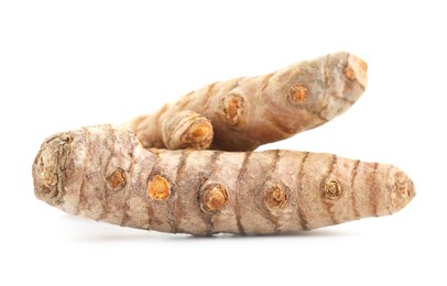 Photo of Two fresh turmeric roots isolated on white