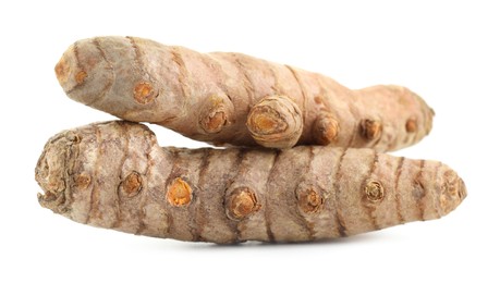 Photo of Two fresh turmeric roots isolated on white