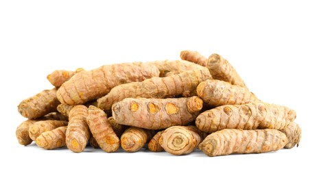 Photo of Pile of fresh turmeric roots isolated on white