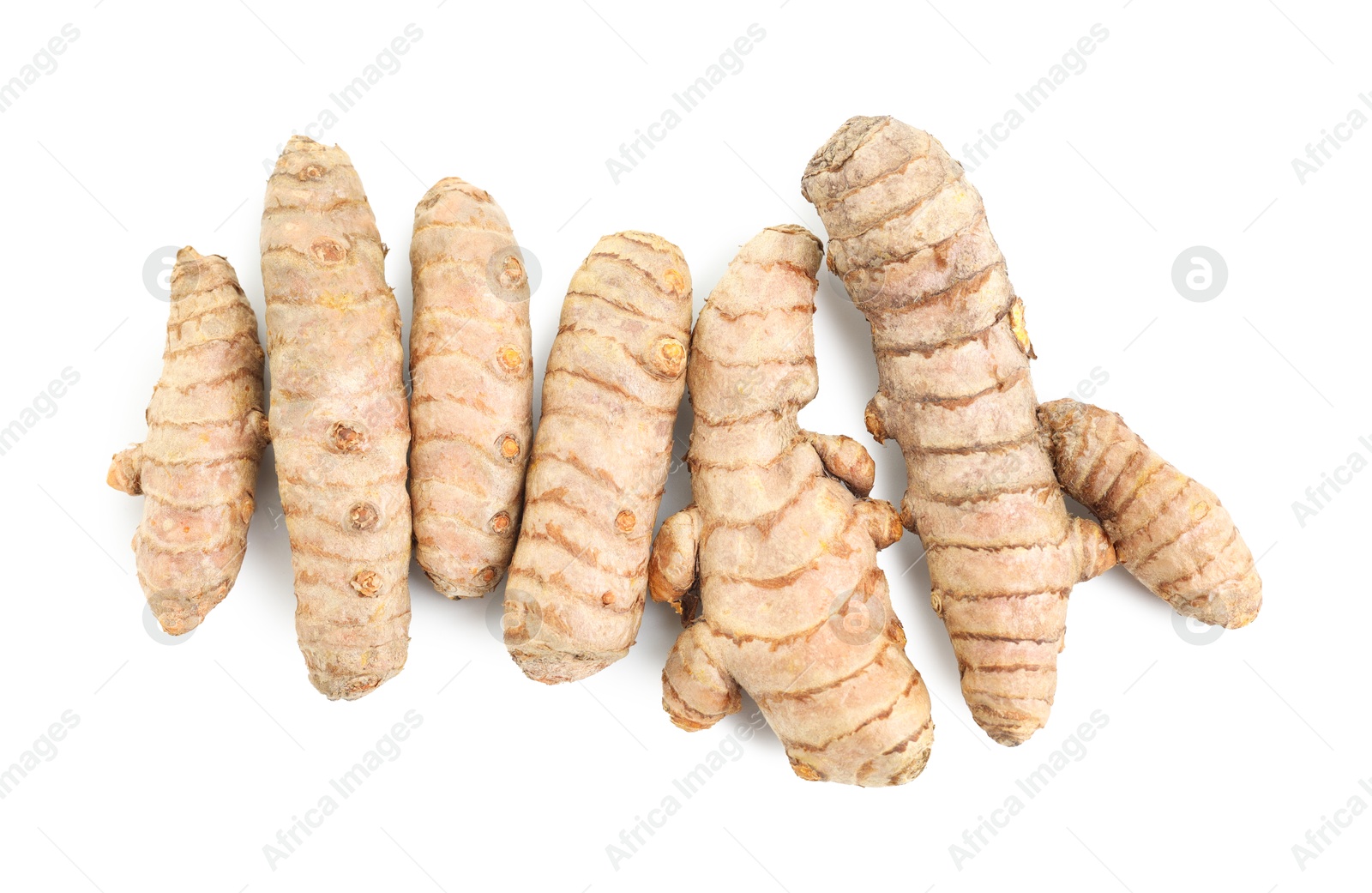 Photo of Fresh turmeric roots isolated on white, top view