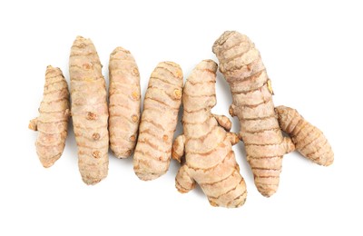 Photo of Fresh turmeric roots isolated on white, top view