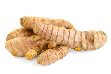 Photo of Pile of fresh turmeric roots isolated on white