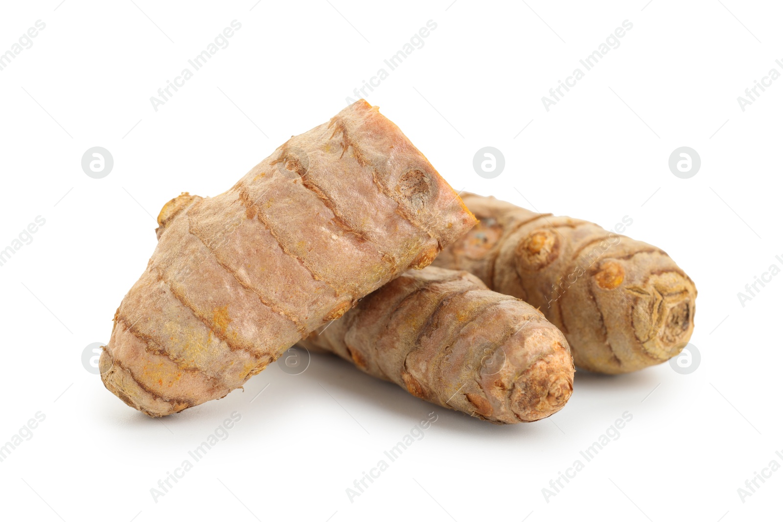 Photo of Whole and cut turmeric roots isolated on white