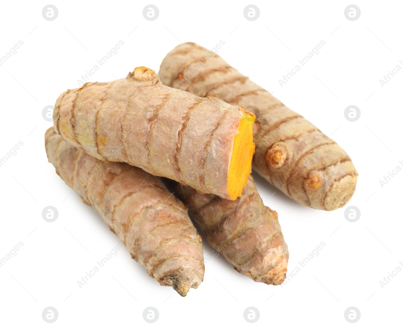 Photo of Whole and cut turmeric roots isolated on white