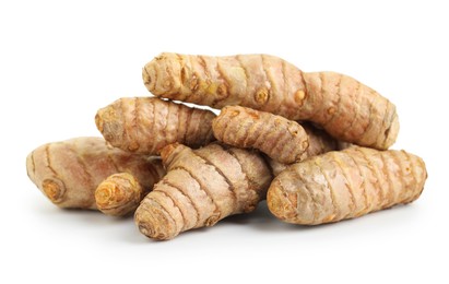 Photo of Pile of fresh turmeric roots isolated on white