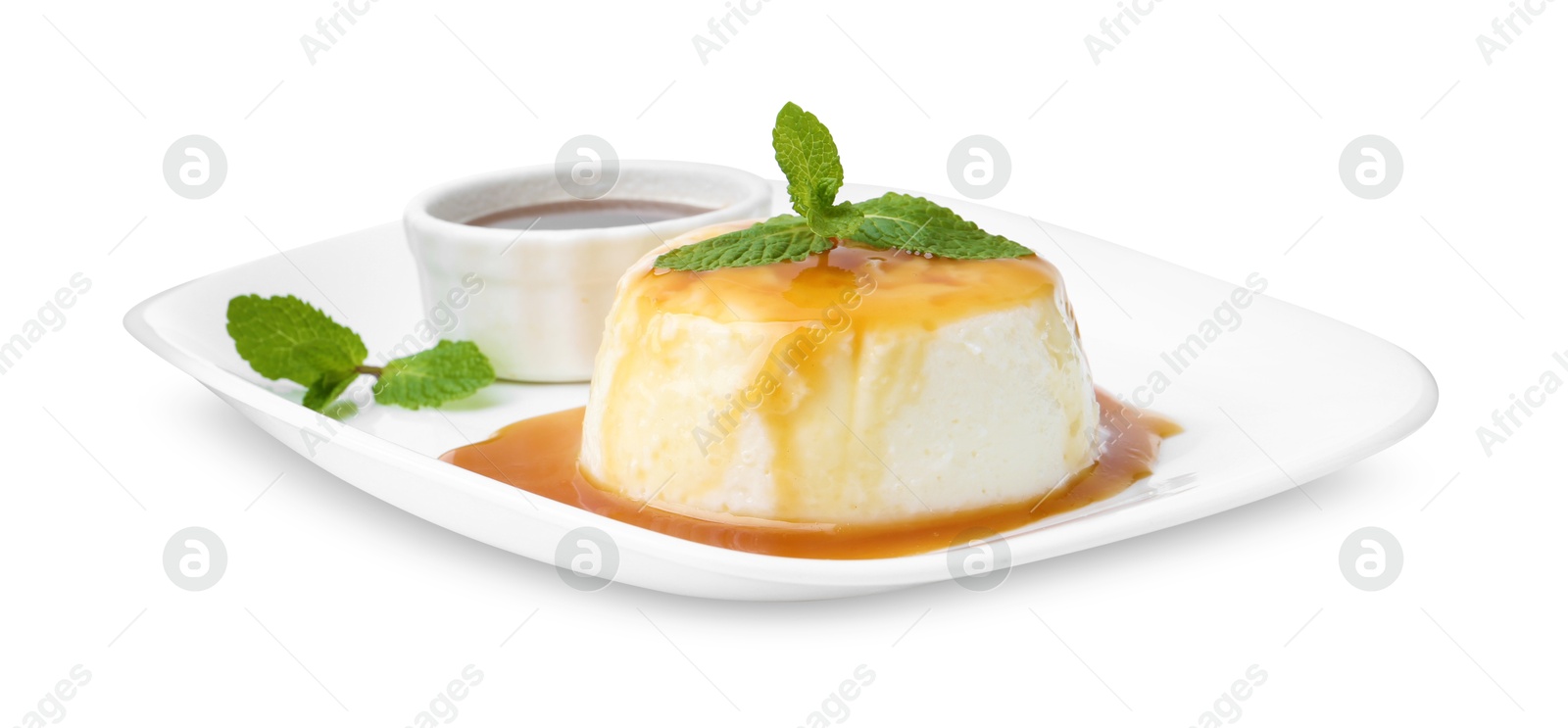 Photo of Tasty pudding with caramel sauce and mint isolated on white