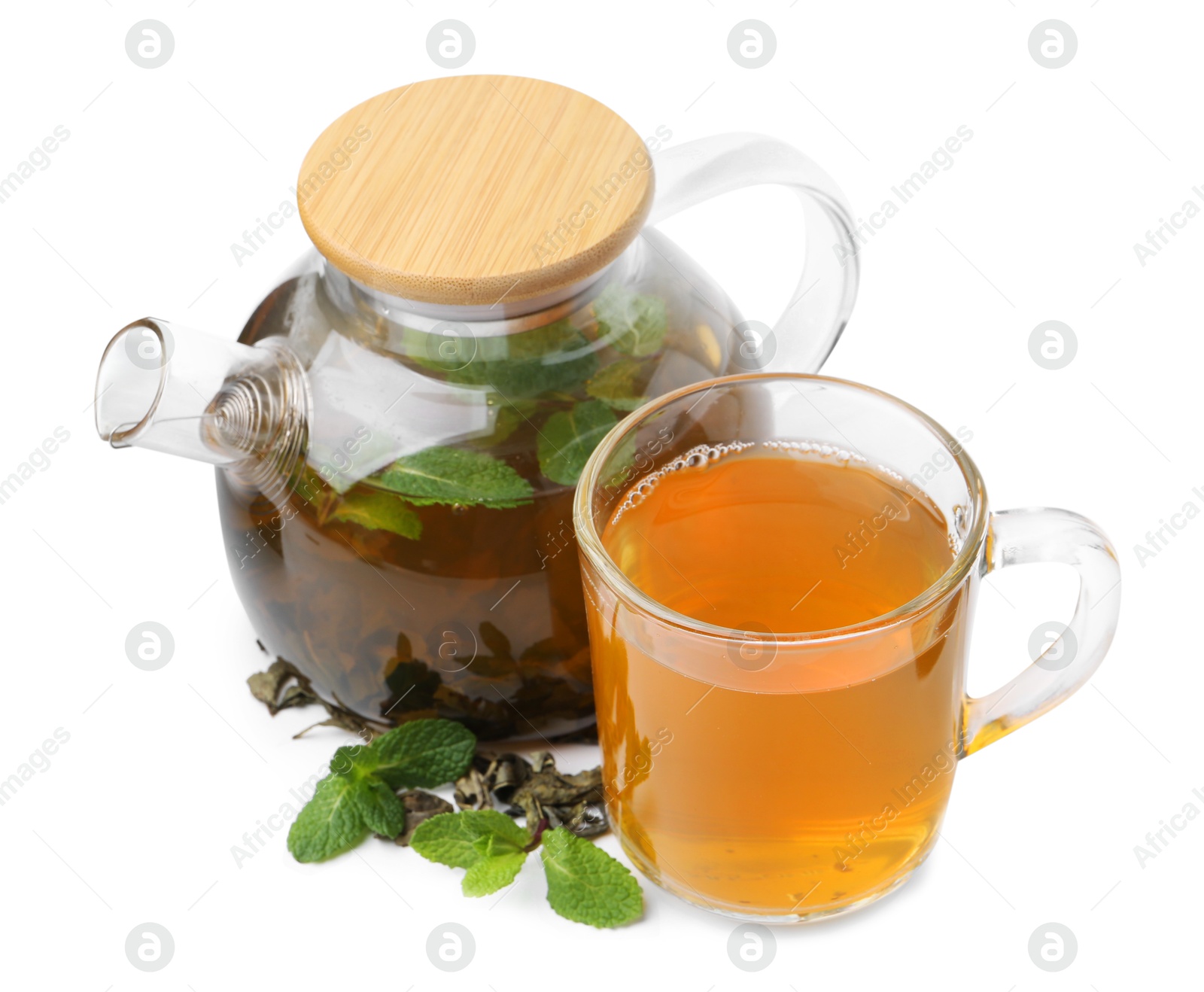 Photo of Aromatic mint tea, fresh and dried leaves isolated on white