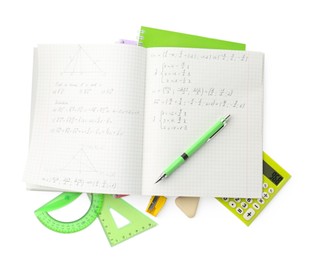 Photo of Doing homework. Notebook with math assignment and stationery on white background, top view