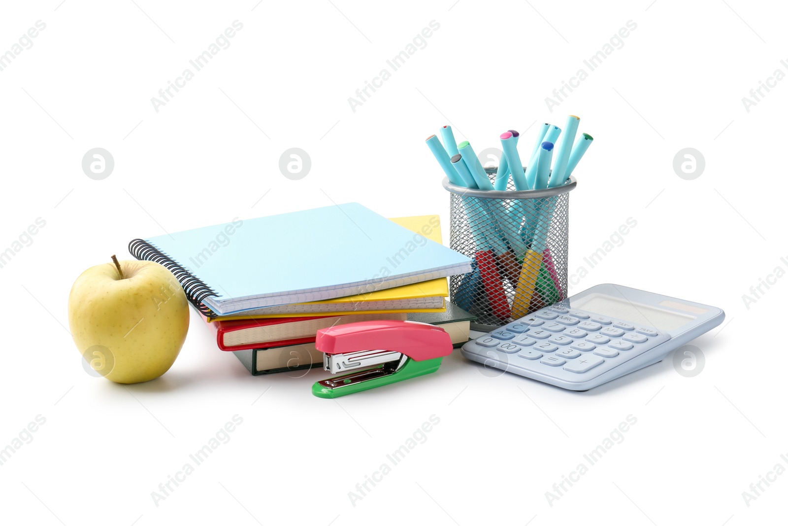 Photo of Doing homework. Notebooks, apple and stationery on white background