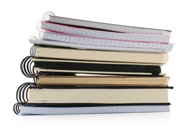 Photo of Stack of different notebooks isolated on white