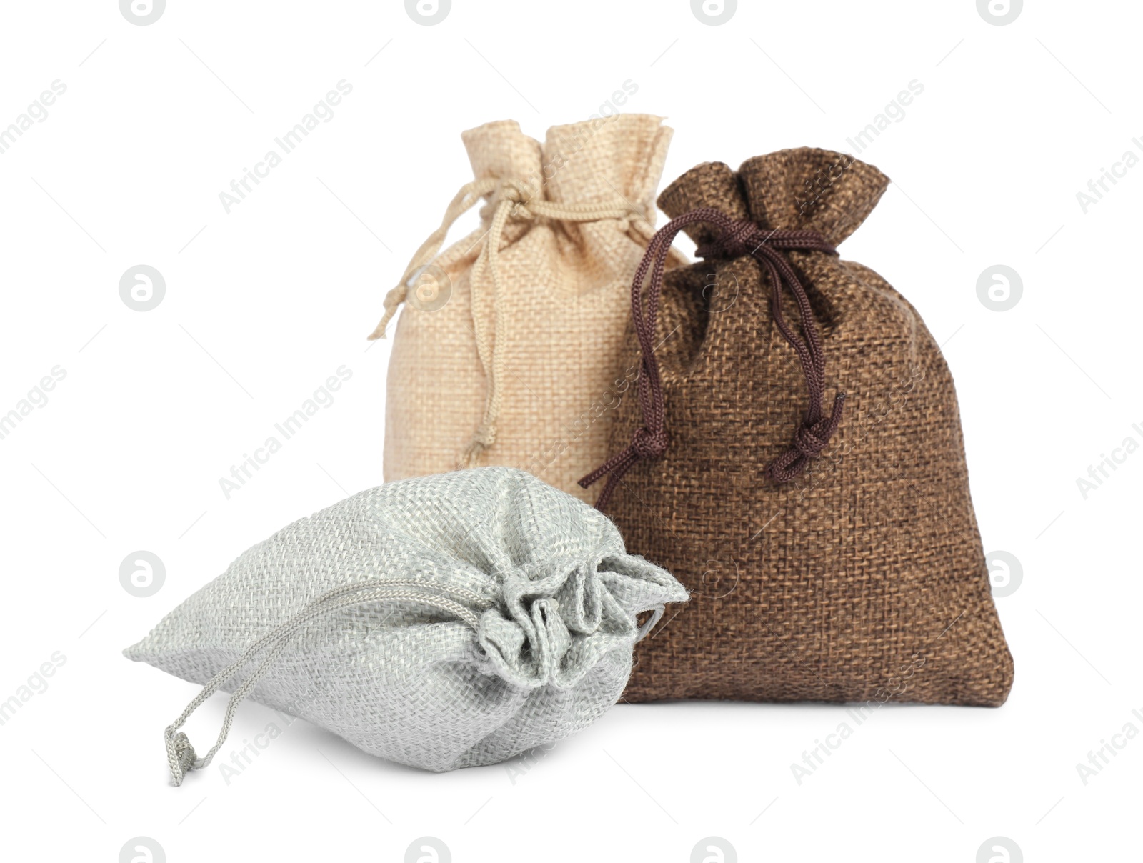 Photo of Three small burlap sacks isolated on white