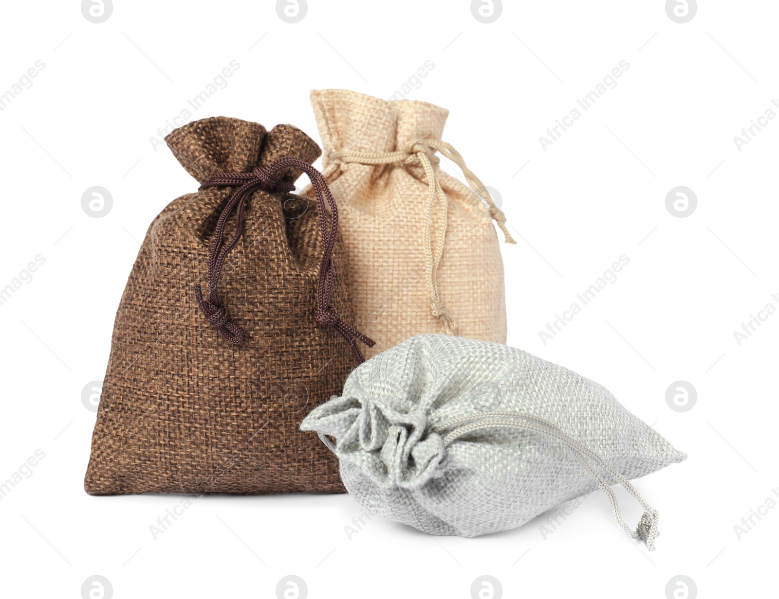 Photo of Three small burlap sacks isolated on white