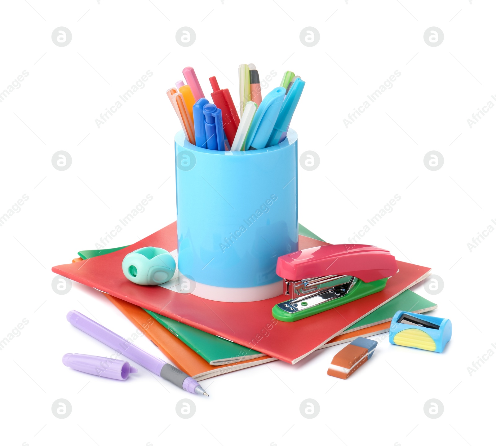 Photo of Doing homework. Copybooks and other different stationery on white background