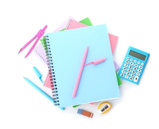 Photo of Doing homework. Notebooks and other different stationery on white background, top view