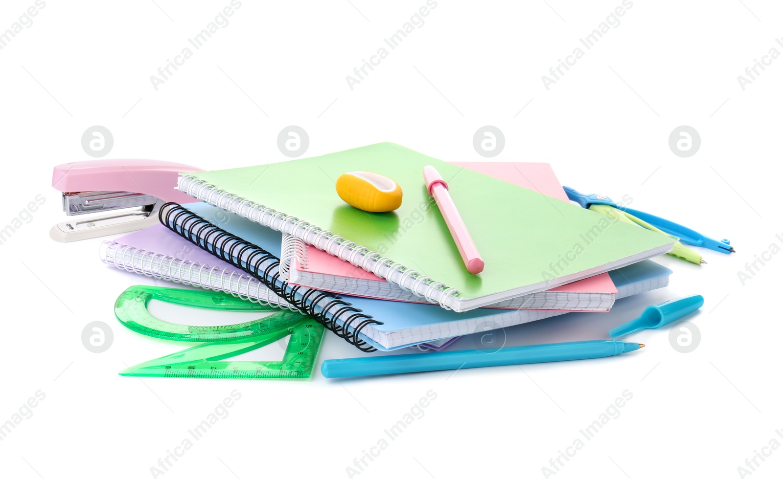 Photo of Doing homework. Notebooks and other different stationery on white background