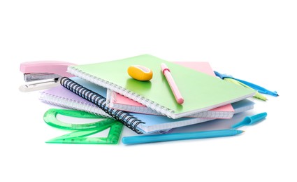 Photo of Doing homework. Notebooks and other different stationery on white background