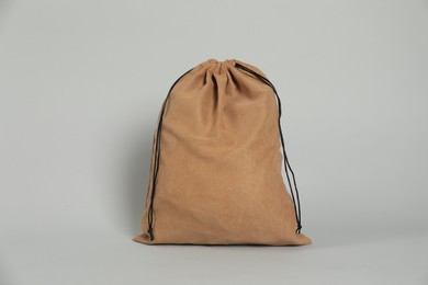 Photo of One brown cotton bag on grey background