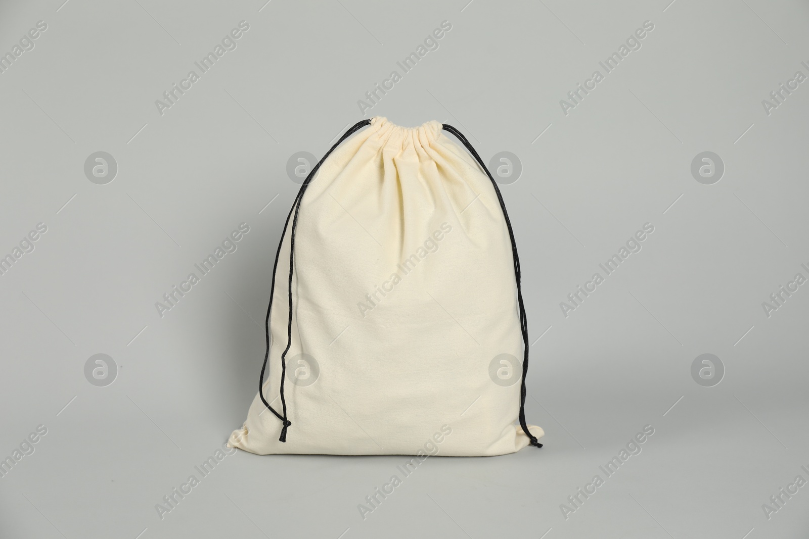 Photo of One beige cotton bag on grey background