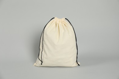 One beige cotton bag on grey background