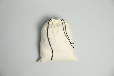 Photo of Cotton bag on grey background, top view