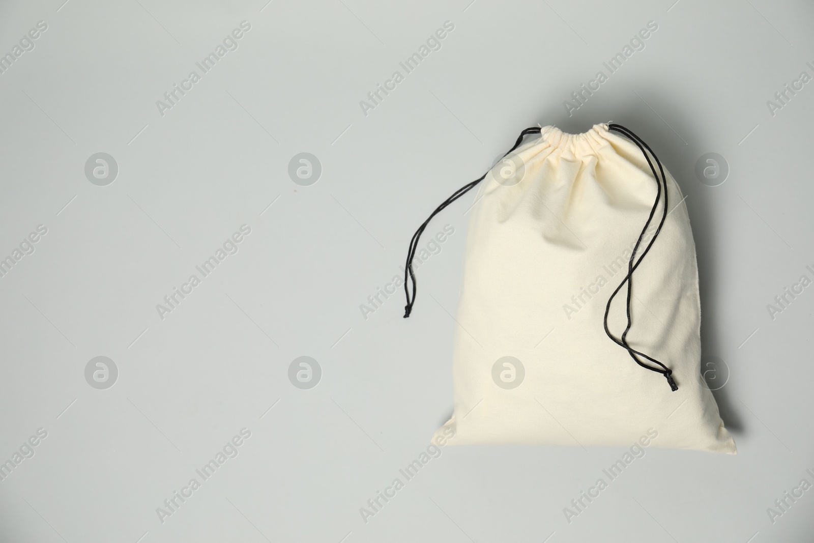 Photo of Cotton bag on grey background, top view. Space for text