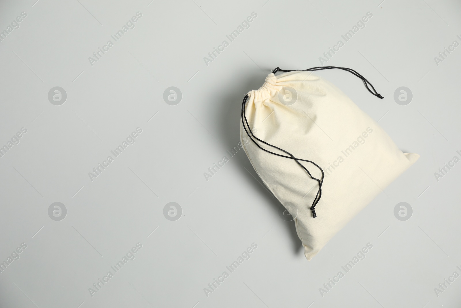 Photo of Cotton bag on grey background, top view. Space for text