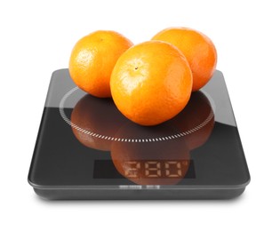 Photo of Electronic kitchen scale with tangerines isolated on white