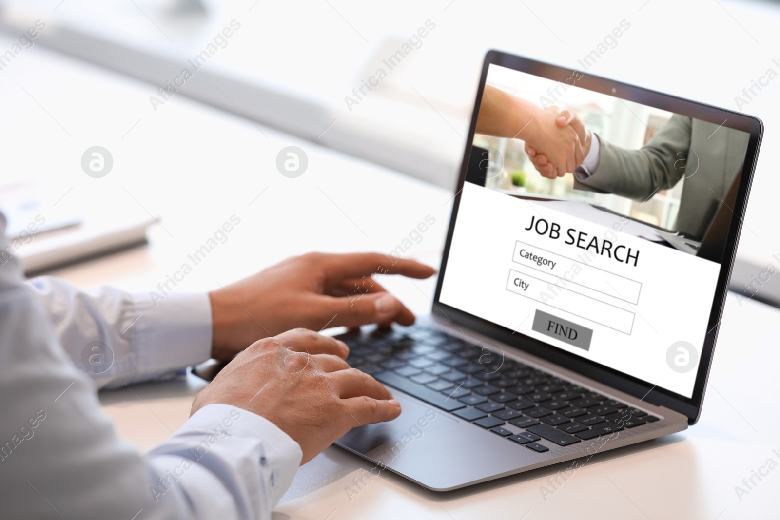 Image of Job search. Man using employment website on laptop at home, closeup