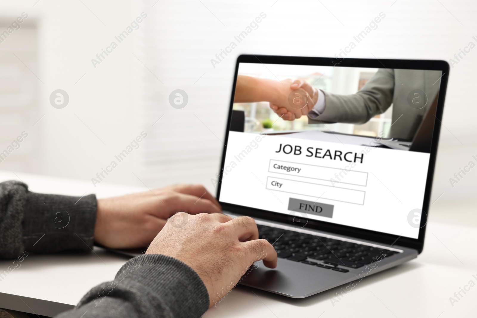 Image of Job search. Man using employment website on laptop at home, closeup