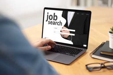 Image of Job search. Man using employment website on laptop at home, closeup