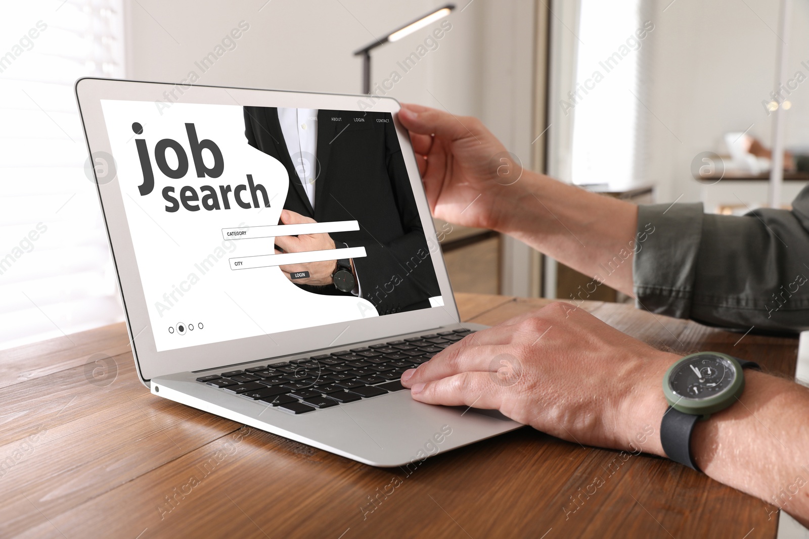 Image of Job search. Man using employment website on laptop at home, closeup