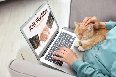 Image of Job search. Woman with cat using employment website on laptop at home, closeup