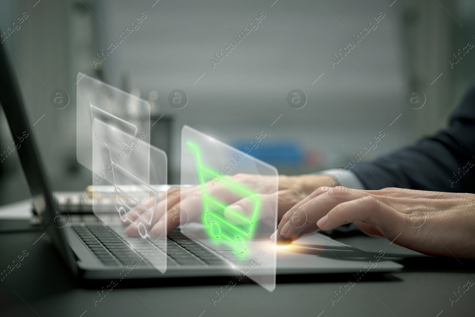 Image of Woman shopping online using laptop, closeup. Illustrations of shopping cart over device