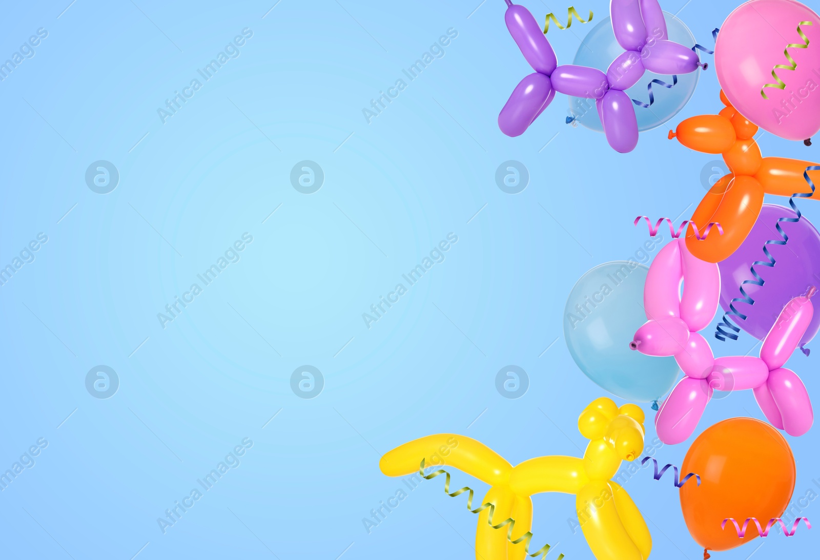 Image of Bright balloons and party streamers on light blue background, space for text