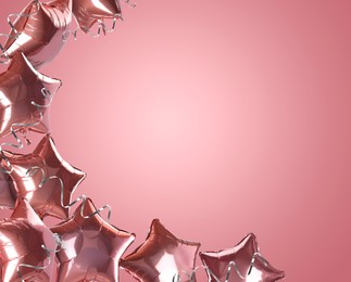 Image of Star-shaped balloons and party streamers on pink background, space for text