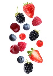 Image of Blueberries, cherries, raspberries, blackberries, strawberries and redcurrant berries in air on white background