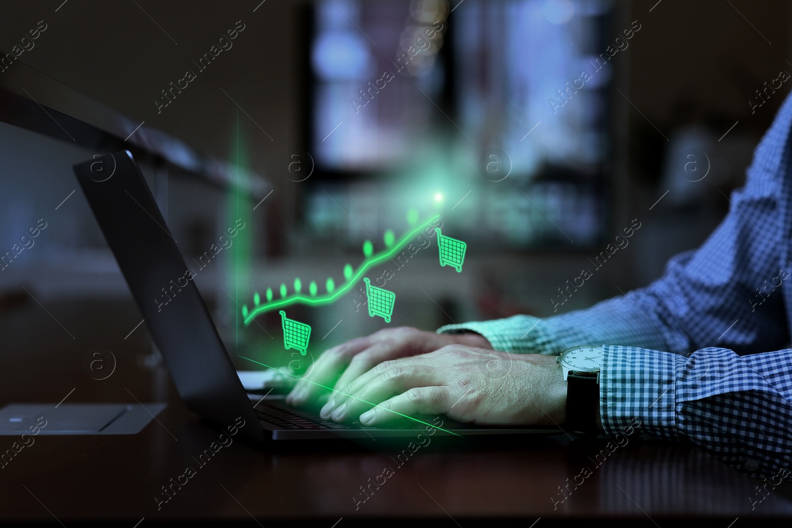 Image of Man tracking price growth using laptop, closeup. Graph over device. Internet shopping concept