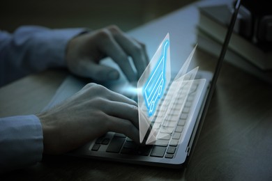 Image of Man shopping online using laptop, closeup. Illustrations of shopping cart over device