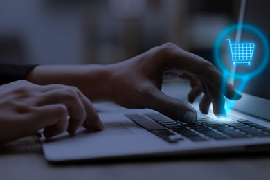 Image of Man shopping online using laptop, closeup. Illustration of shopping cart over device