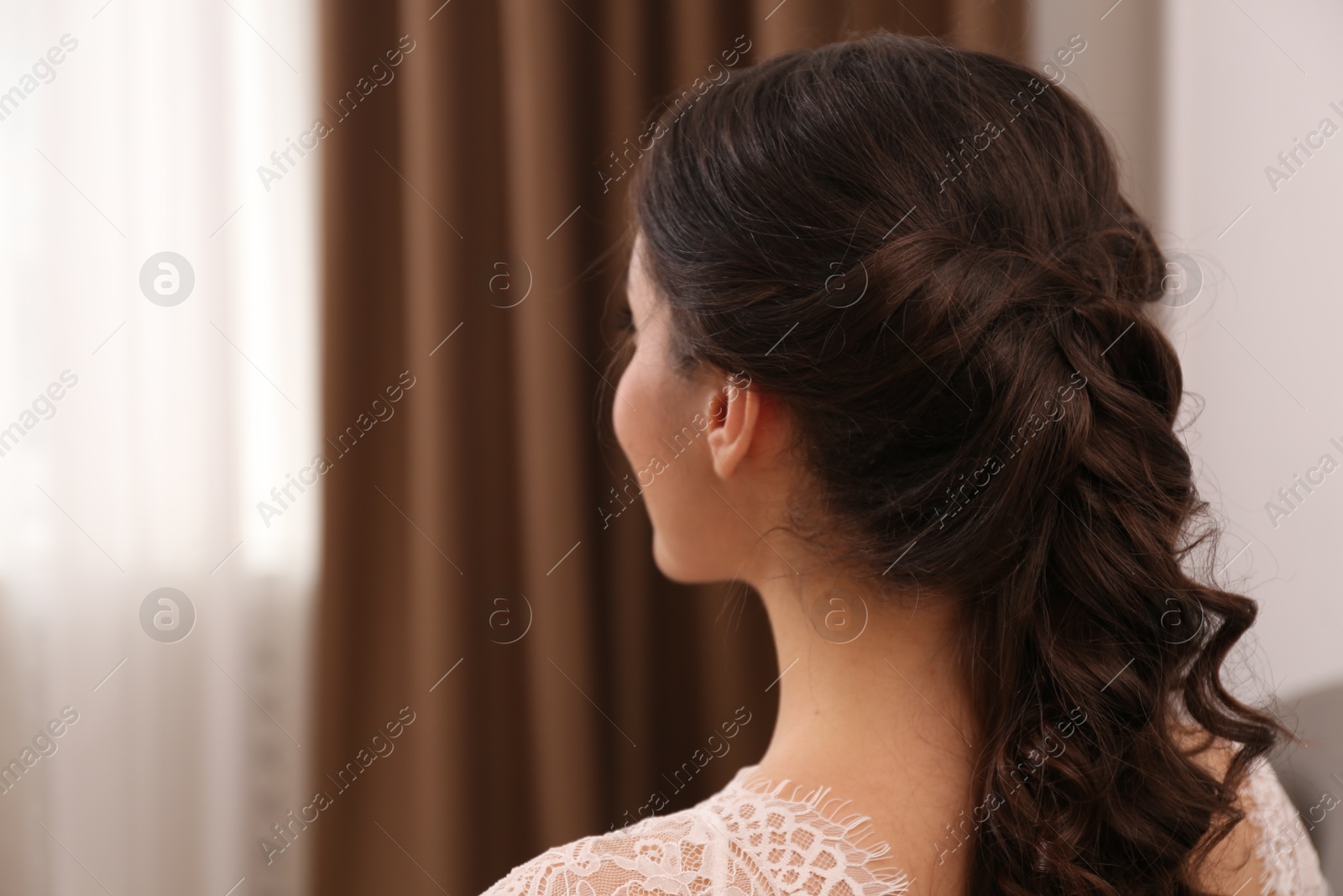 Photo of Young woman with beautiful hairstyle indoors. Space for text