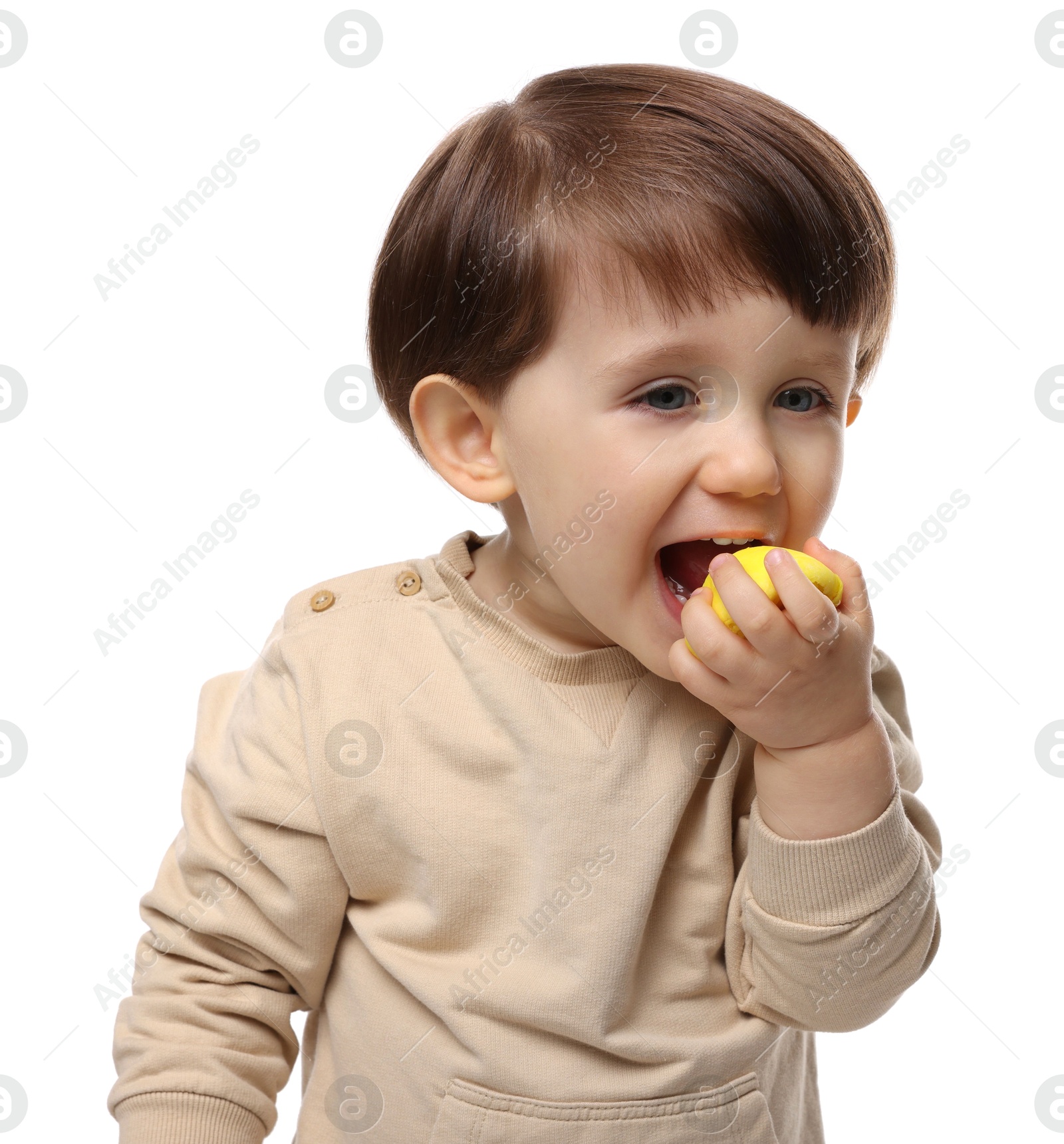 Photo of Cute little child eating tasty mochi on white background