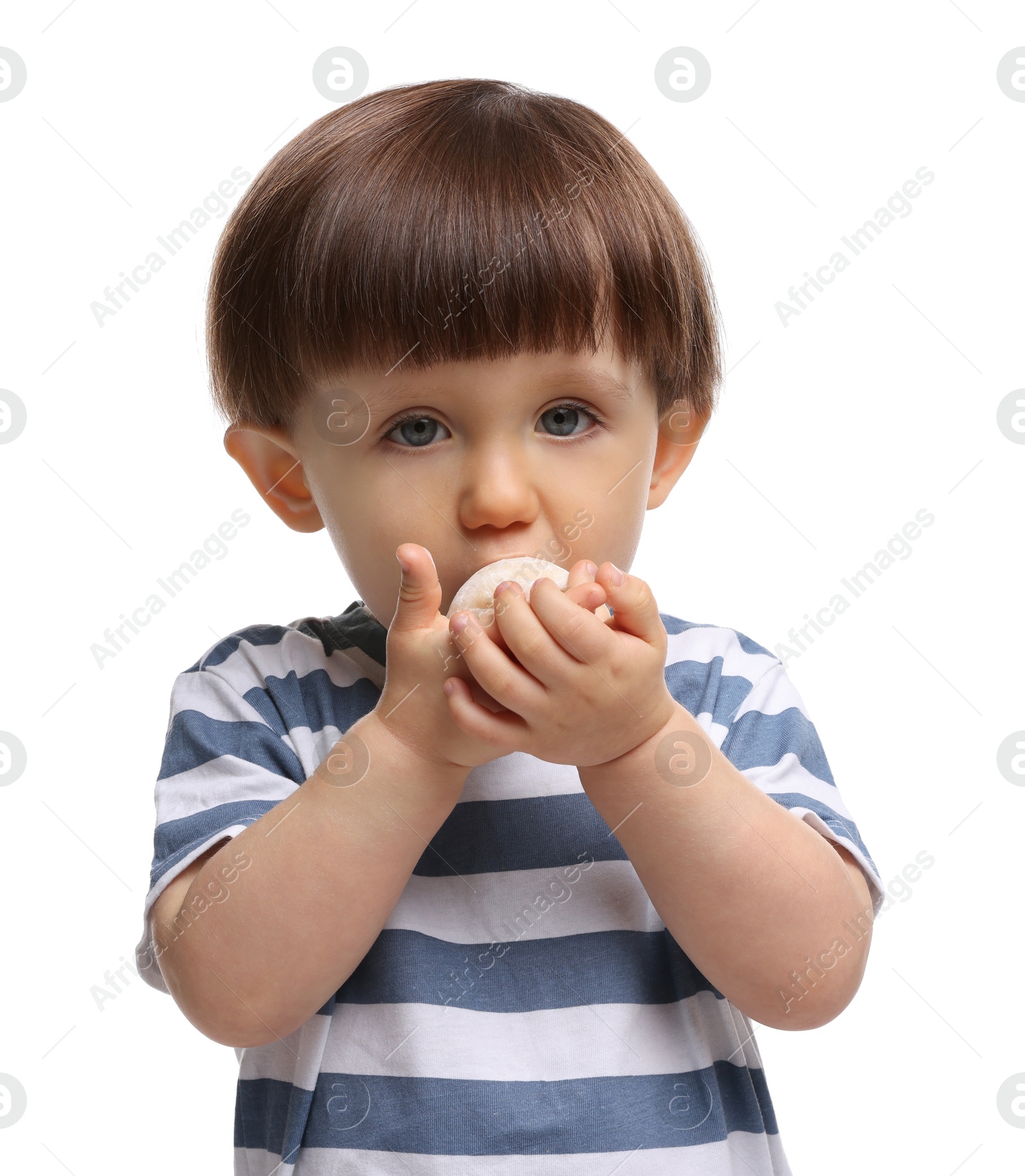 Photo of Cute little child eating tasty mochi on white background