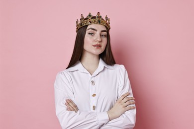 Photo of Woman in elegant crown on pink background