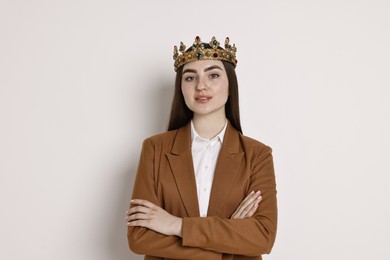 Photo of Businesswoman in elegant crown on light background