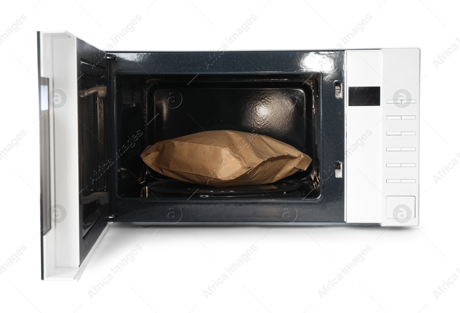 Photo of Open microwave oven with bag of popcorn isolated on white