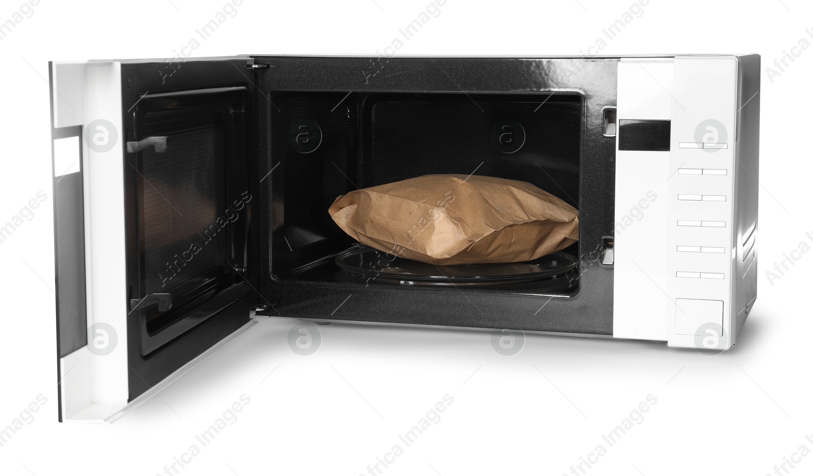 Photo of Open microwave oven with bag of popcorn isolated on white