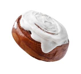 Photo of Tasty cinnamon roll with cream isolated on white