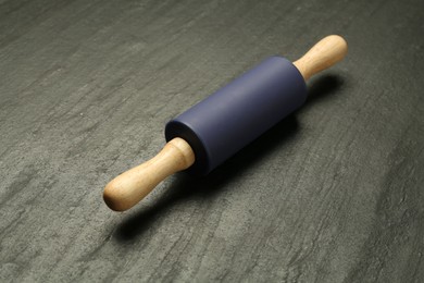 Photo of Rolling pin on dark gray textured table