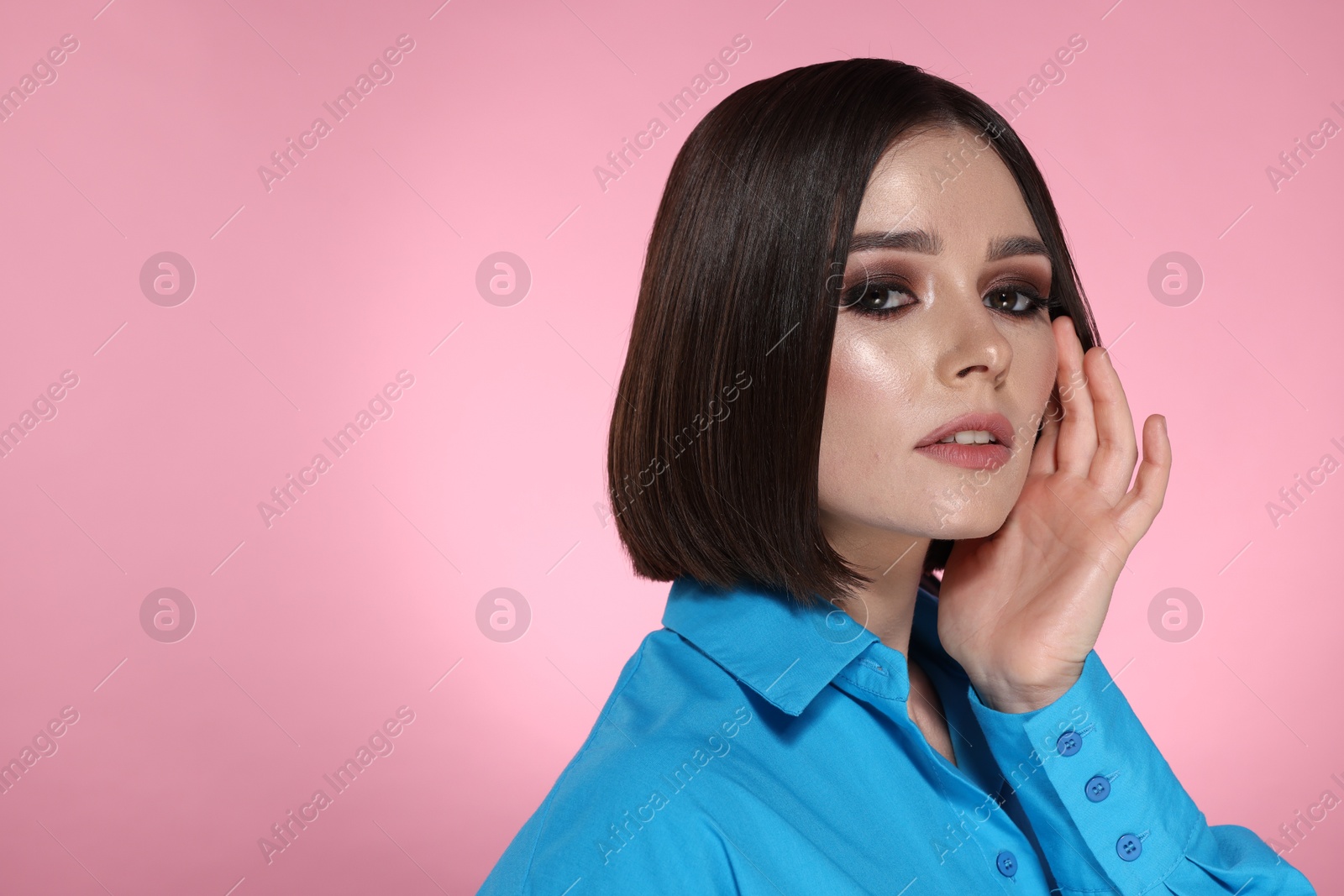 Photo of Portrait of beautiful young woman with gorgeous straight hair on pink background, space for text