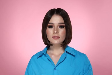 Photo of Portrait of beautiful young woman with gorgeous straight hair on pink background